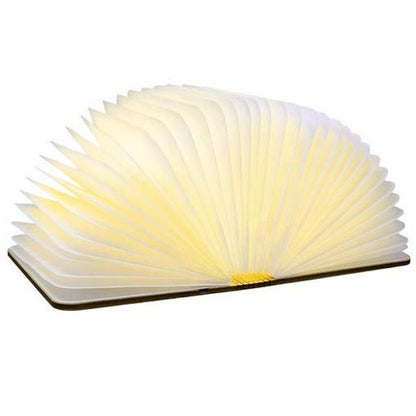 sculptural light emitting a wonderful ambient warm white soft LED light through the pages